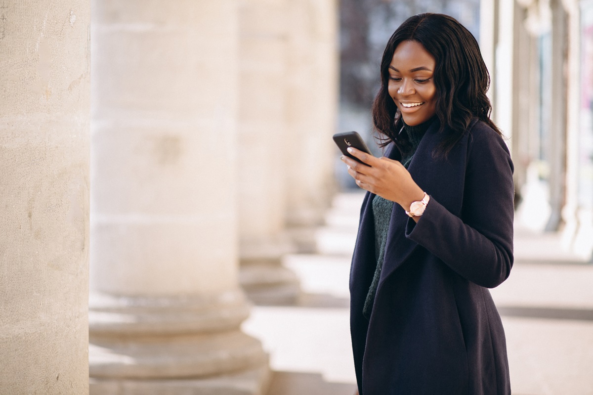 Professional woman managing finances with mobile banking